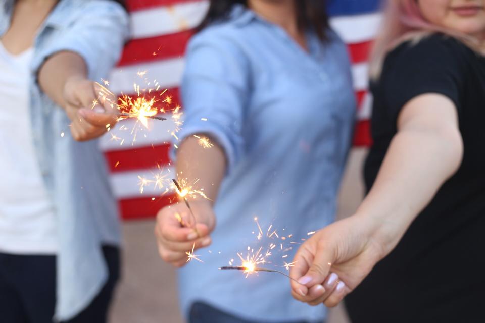 sparklers people hands celebration american flag party friends group 