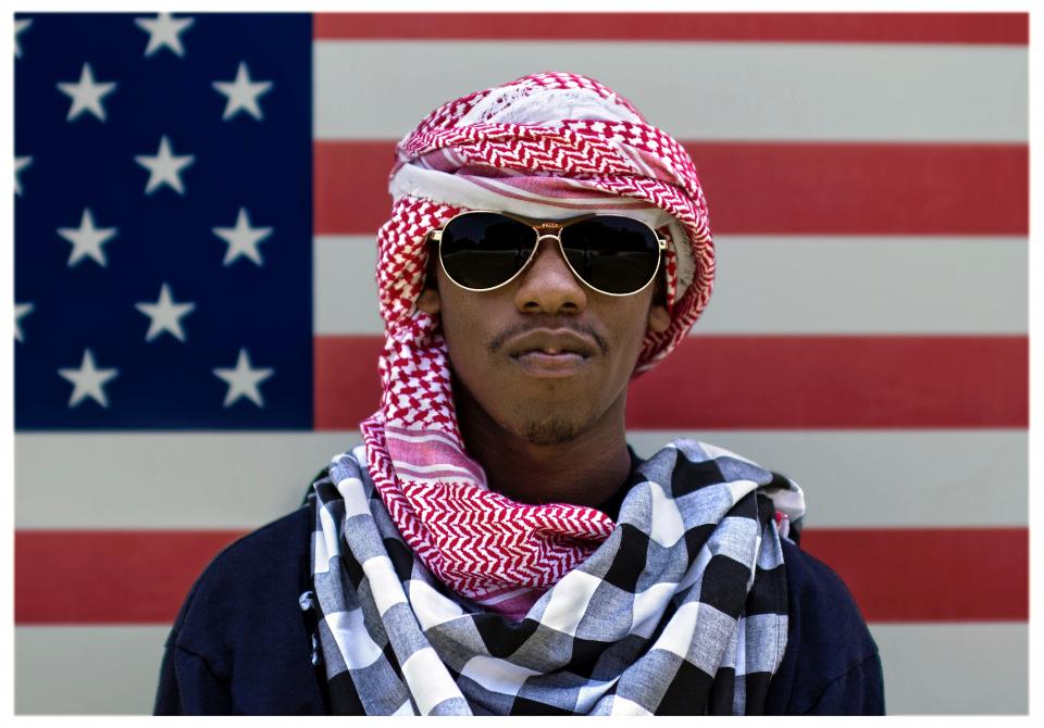 people man guy scarf shawl sunglasses flag