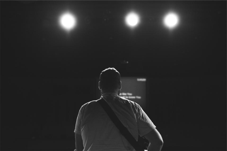 musician music instrument guitar strap man guy people concert spotlights show entertainment