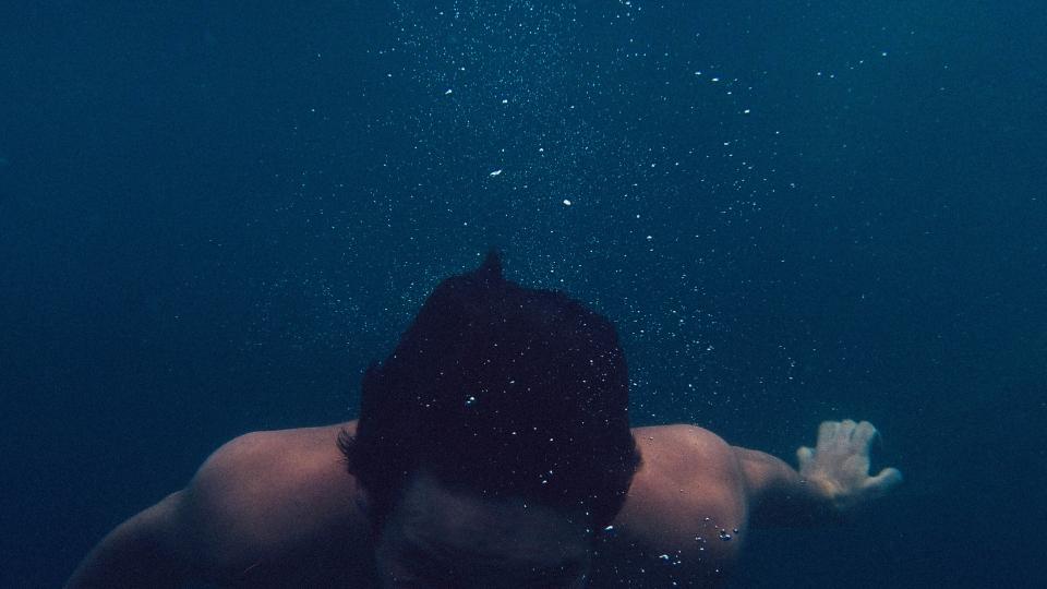 swimming underwater man guy hair bubbles wet