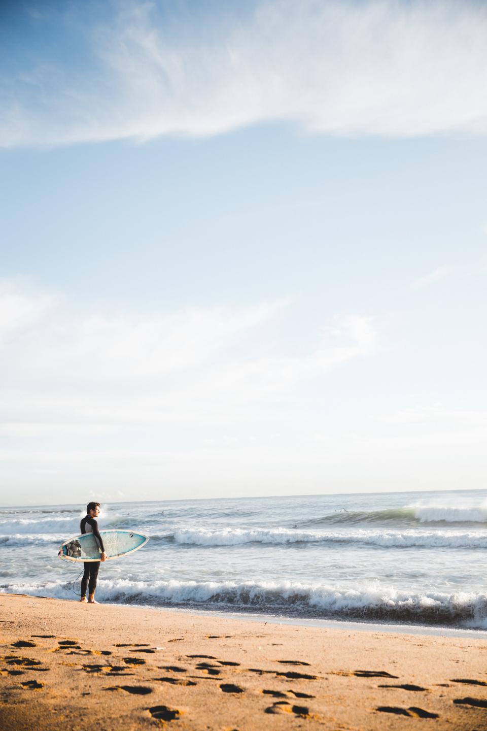 sea, ocean, water, waves, nature, horizon, seashore, coast, beach, white, sand, people, swimming, man, surfer, surfing, board, sports, adventure, sky, landscape, view, footprints