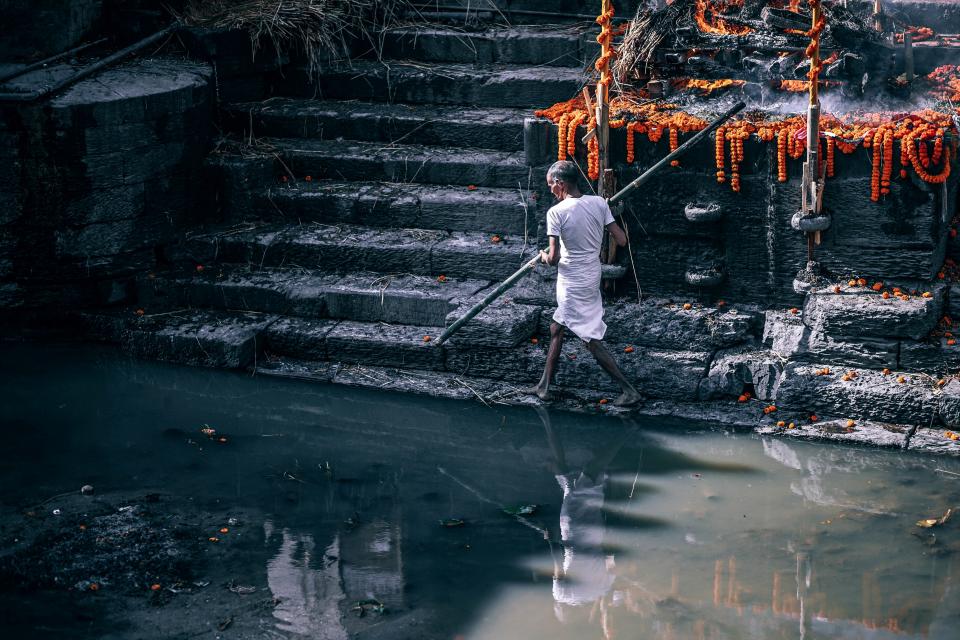 people man walking outdoor water reflection rocks stair