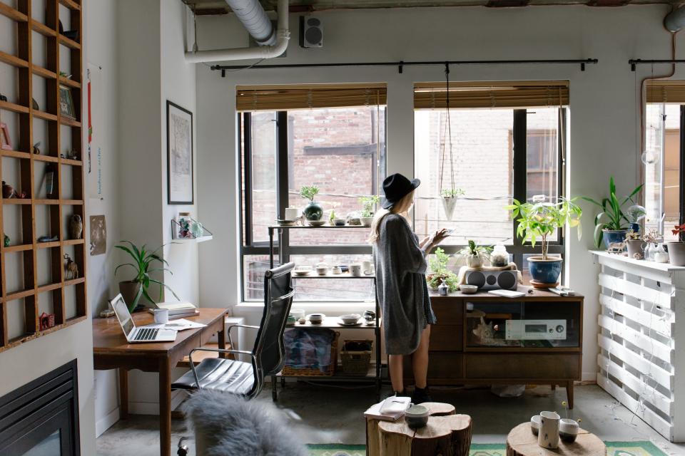 decor design creative business office girl woman fashion model hat computer laptop macbook desk furniture tables chairs working technology