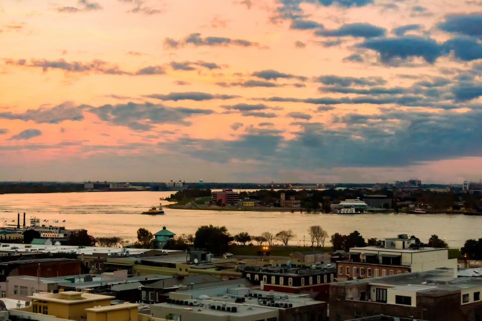 nature landscape sun sunny sunset sunrise clouds sky city aerial travel ocean sea water building infrastructure structure trees house urban city architecture