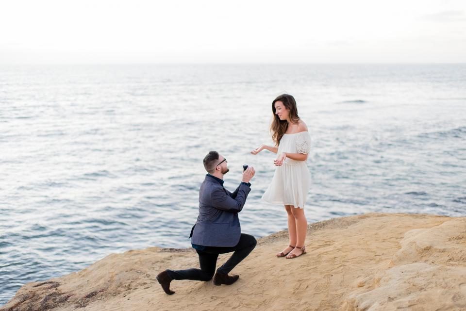 people, couple, man, girl, propose, engagement, ring, sea, water, ocean, nature, hill, sky