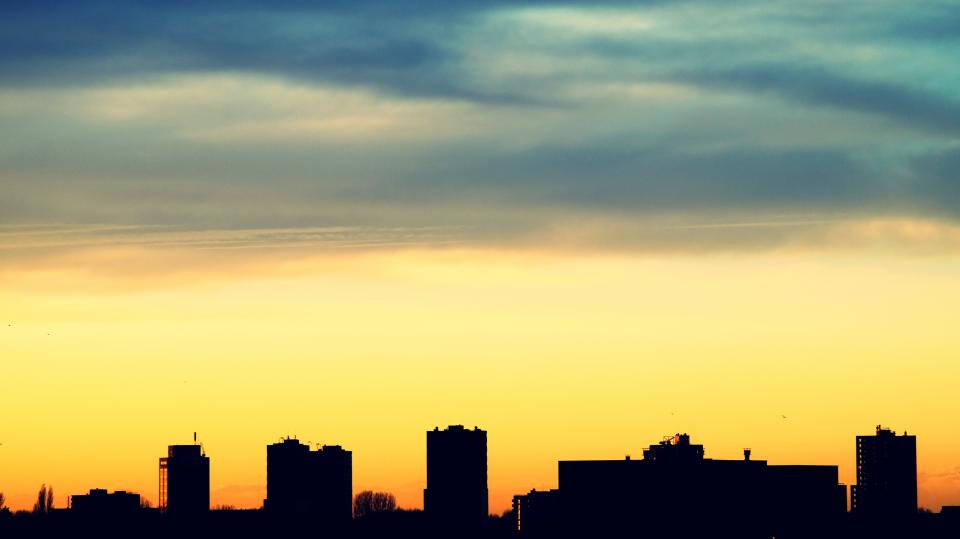 urban city establishment building structure infrastructure shadow silhouette sunset clouds sky