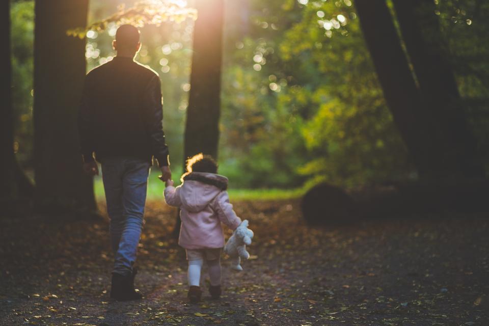 father, daughter, dad, girl, young, family, child, stuffed animal, toy, walking, forest, woods, outdoors, leaves, fall, autumn, nature, people