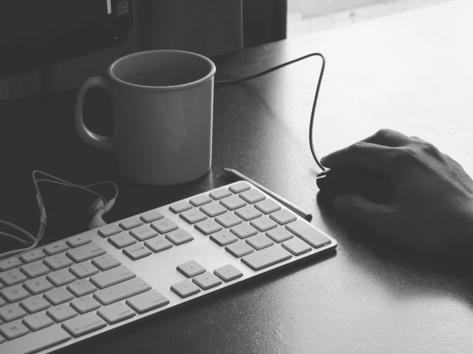 mug, cup, coffee, keyboard, mac, mouse, hand, computer, typing, work, earbuds, pencil, black and white, technology, business