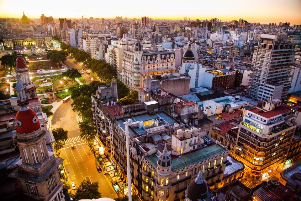 architecture building infrastructure sky skyscraper tower city urban skyline lights rooftops road street car vehicle trees plant
