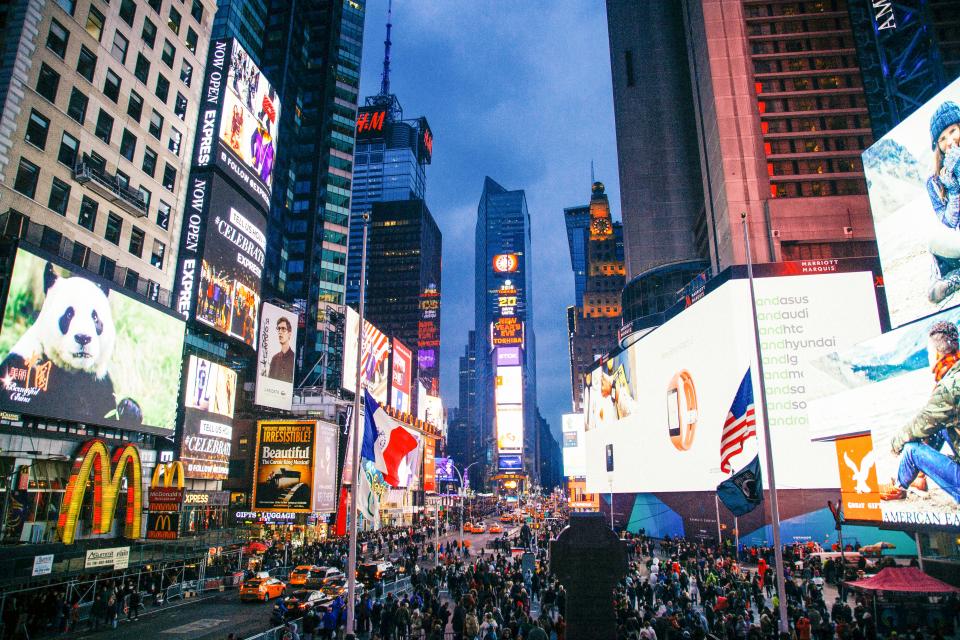 Times Square New York city NYC crowd busy traffic streets roads people pedestrians lights screens buildings architecture downtown towers high rises billboards
