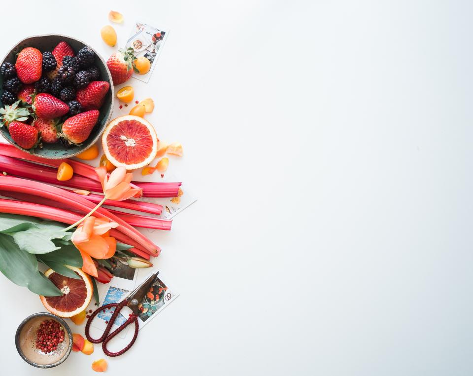 flat lay food dessert fruits orange strawberry crops scissors table white flowers petals picture photograph
