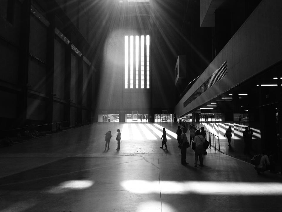 building architecture skylight sunlight people walking black and white