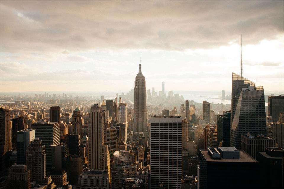 New York city buildings towers skyscrapers downtown urban Empire State sky clouds architecture NYC aerial view