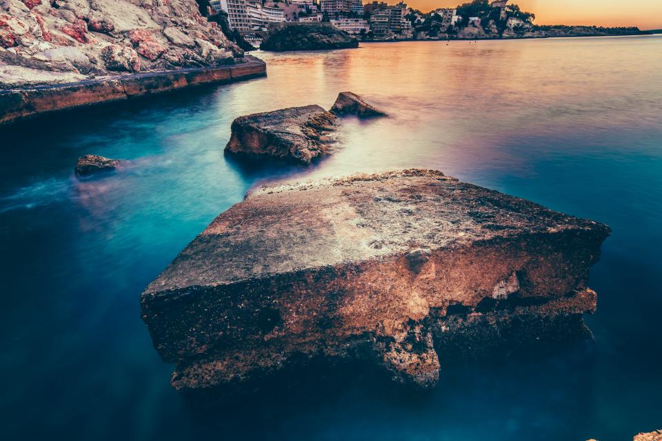 nature landscape water ocean sea beach rocks blue architecture building establishment sunset