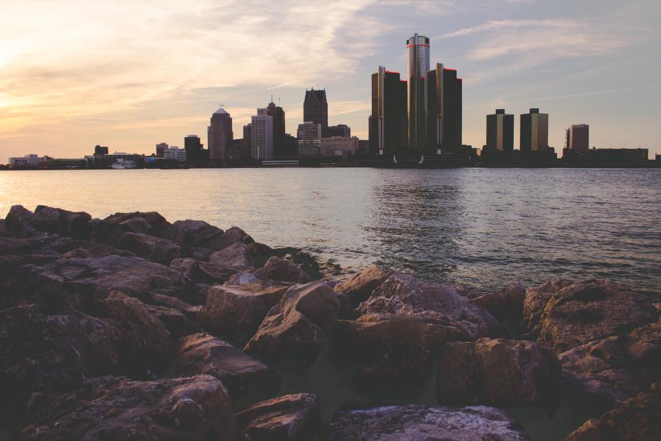 architecture building infrastructure city urban skyline tower rocks coast sea ocean water sunset sunrise sea ocean water reflection