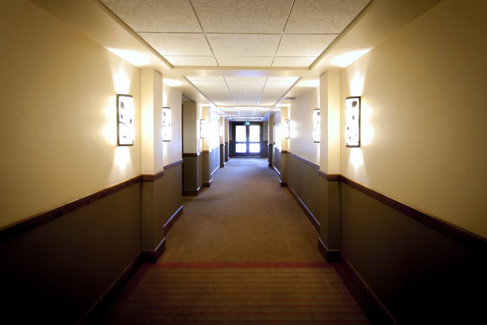 architecture building infrastructure indoor pathway hallway hotel room lights wall