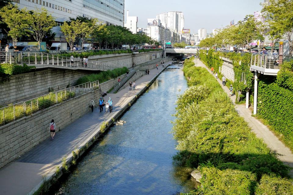 architecture, building, infrastructure, blue, sky, skyscraper, tower, city, urban, skyline, river, water, outdoor, green, grass, road, path, clean