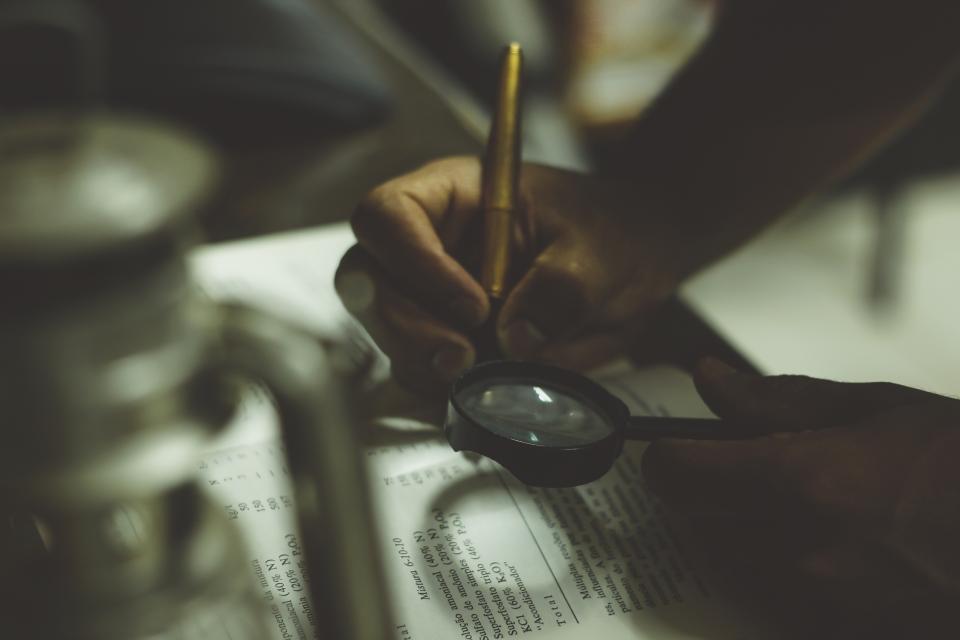 writing book reading magnifying glass pen business learning study education