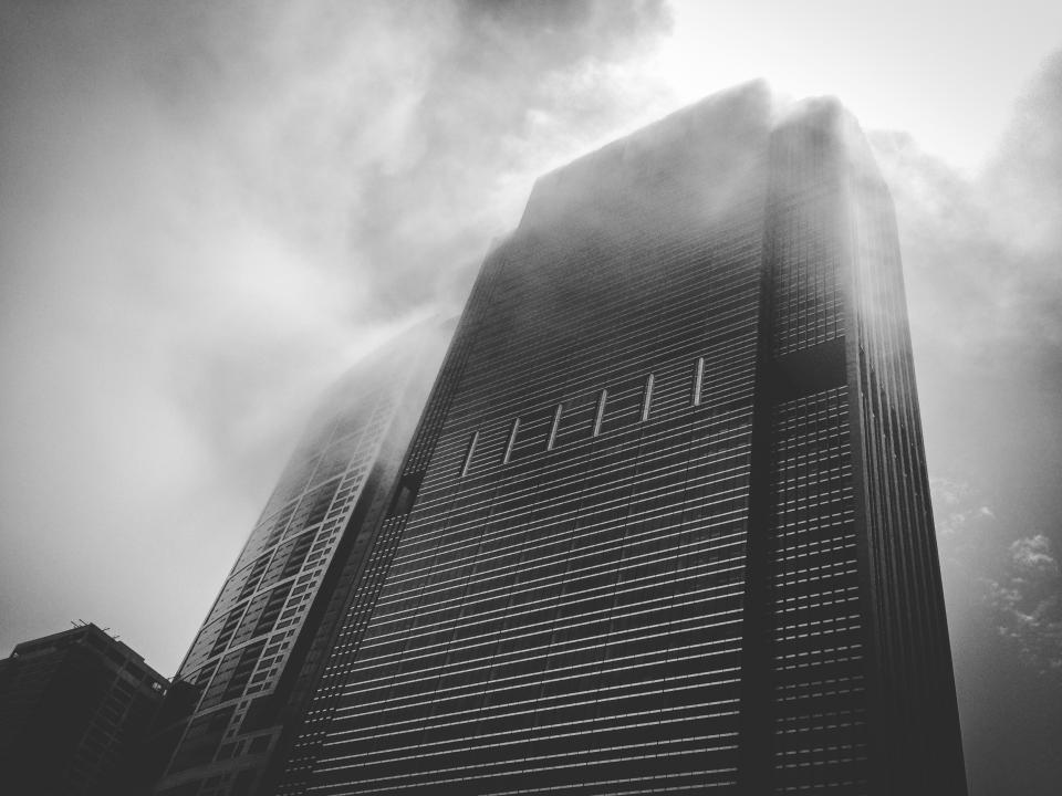 building high rise tower architecture fog clouds black and white city urban