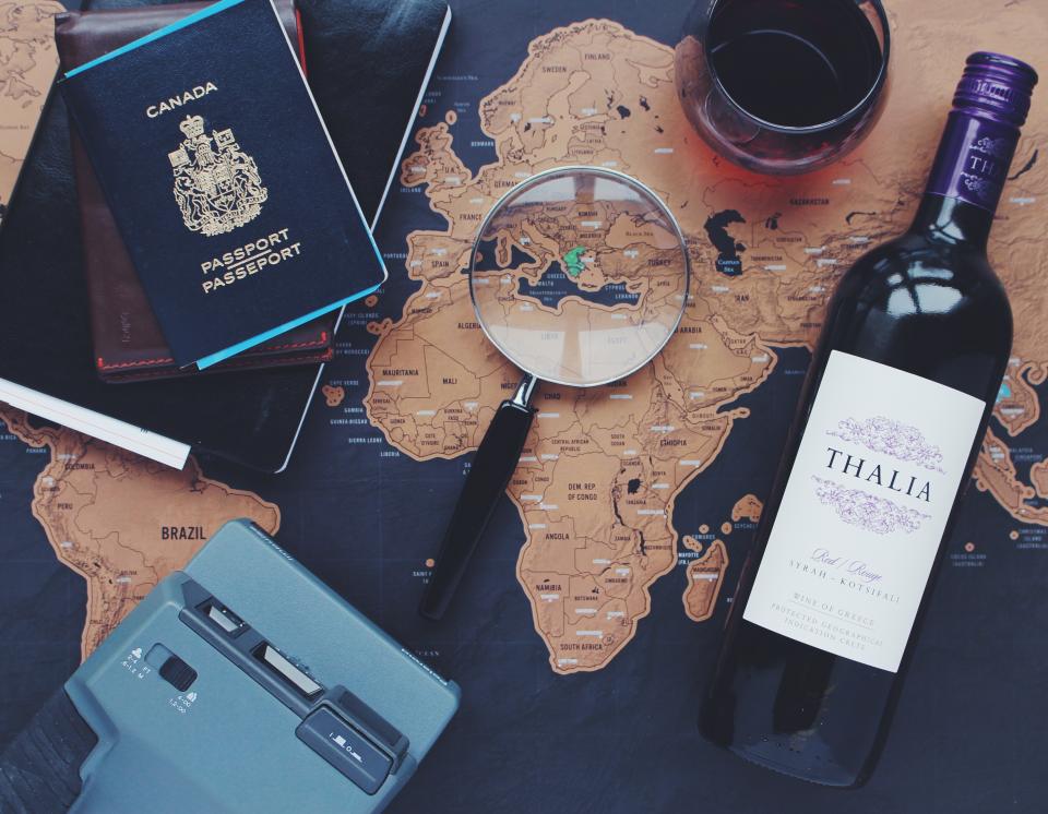 map navigation directions globe travel trip vacation passport magnifying glass polaroid camera wine bottle glass alcohol