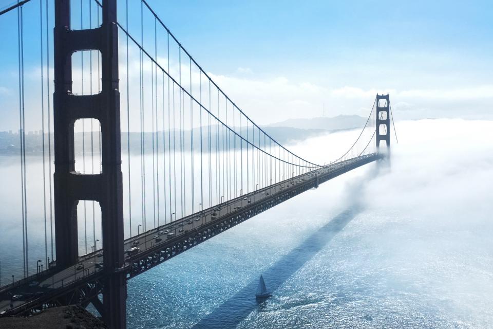 Golden Gate Bridge San Francisco bay architecture sea water sailboat sunny fog sky clouds