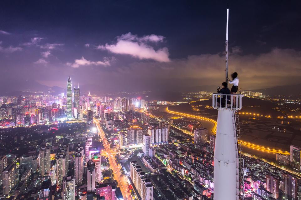 architecture buildings infrastructure sky cloud city tower skyline skyscraper car vehicle street road transportation lights people couple girl guy