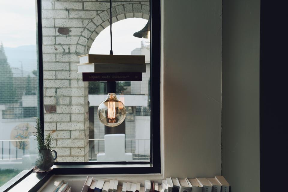 bulb light architecture art design books bookshelves shelf counter window glass room lamp