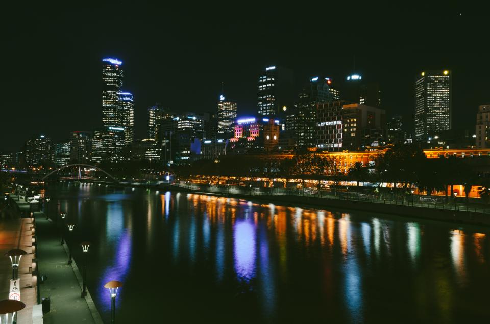 architecture buildings infrastructure dark night sky city skyline skyscraper tower lights urban canal water reflection
