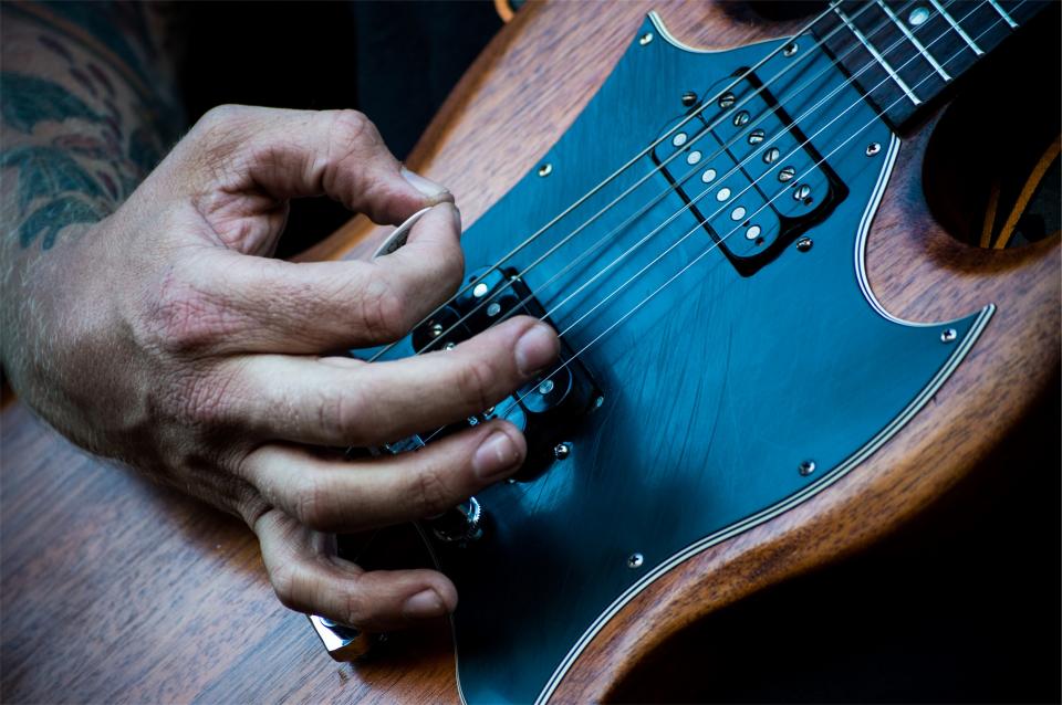 electric guitar musician instrument pick hands music audio